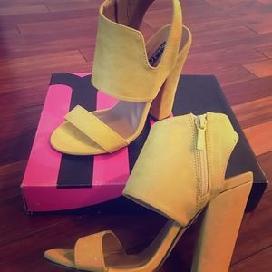 Yellow high heeled shoes